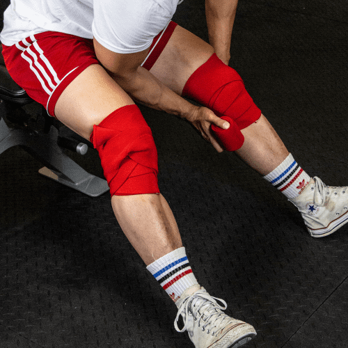 Knee Wraps Red Sept 2020 Jesse wrapping Knees 1 Square 5727da2d 6ebb 455a 9f3f c298958fa21c