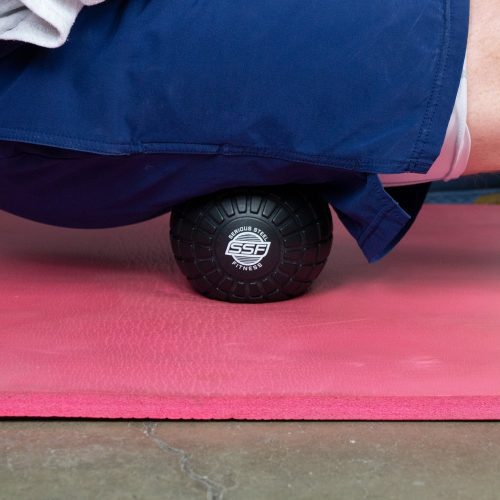 SSF Black Massage Ball In Use On Yoga Mat Pink 1